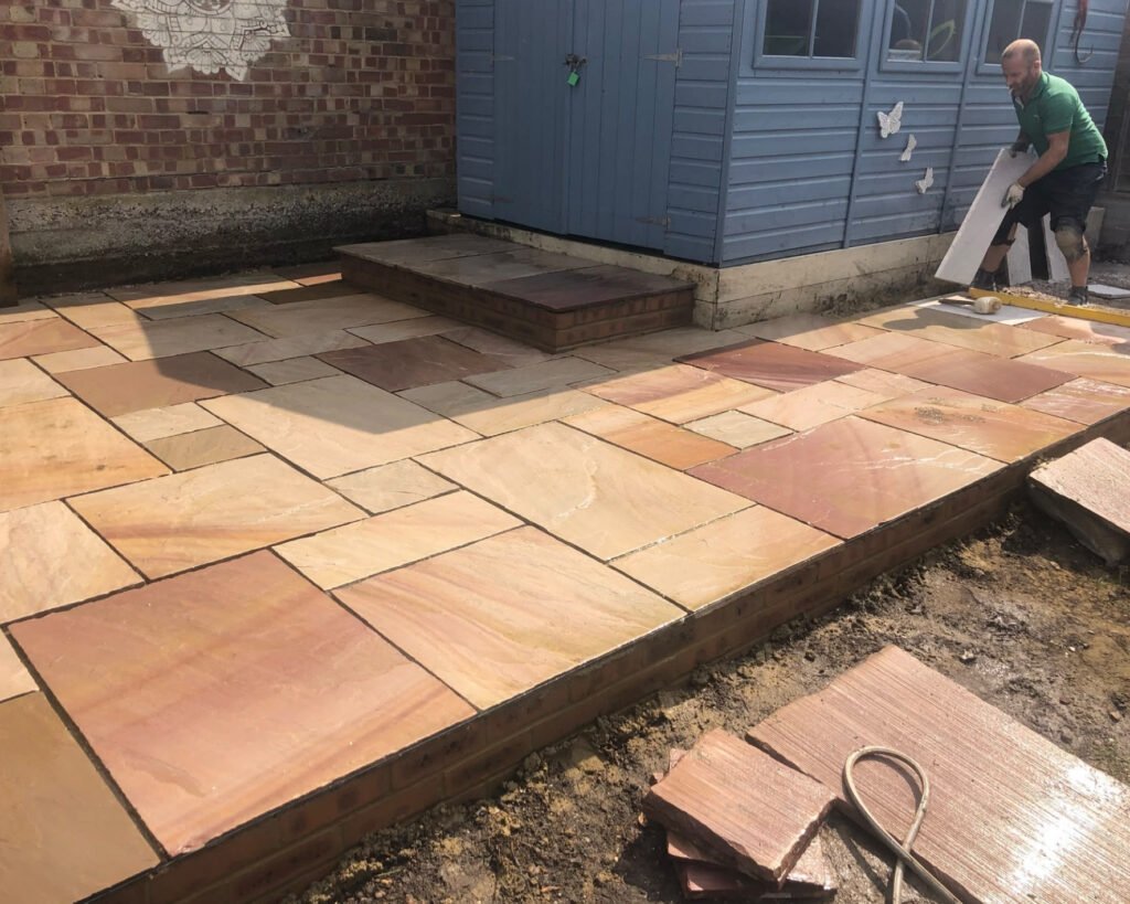 natural-stone-patio-being-laid-in-garden