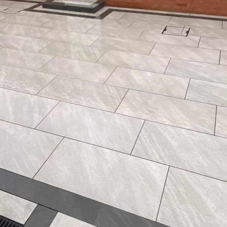 porcelain-patio-install-with-black-borders